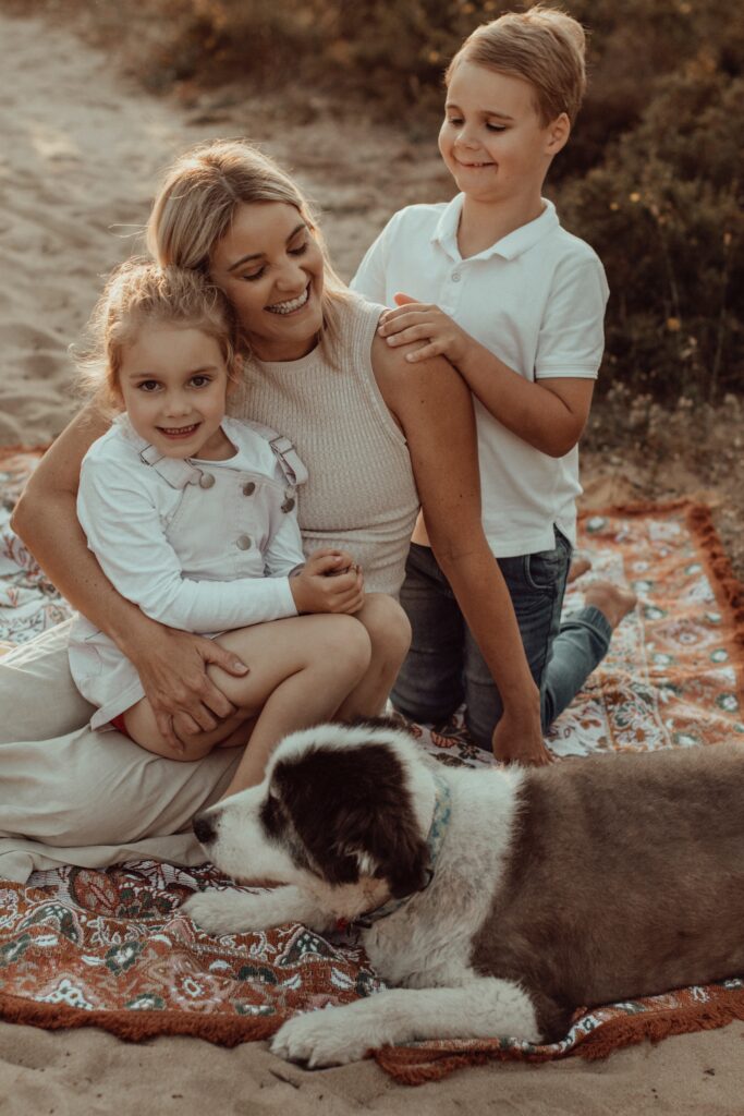 An image from a legacy session with The Lifestyle Phodographer, of Alex the dog and his loving family together in a Perth park. 